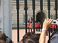 The Old Guard standing in the forecourt of Buckingham Palace