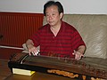 A professor of traditional Chinese music is playing in hostel