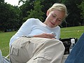 Alex writing SMS on the grass in Hyde Park